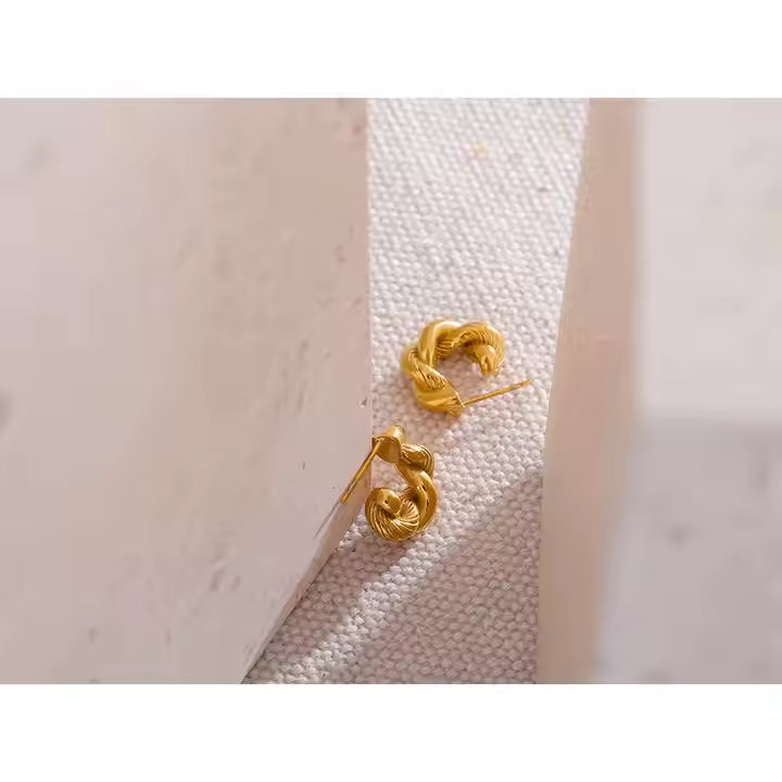 Brincos Argola torcida - Dourado